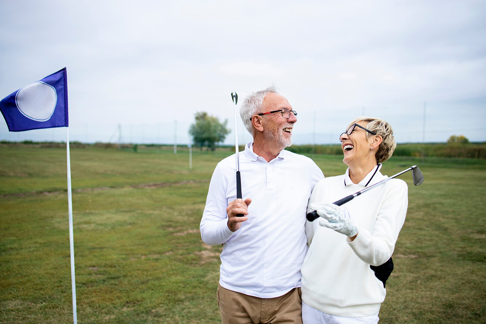 images/insights/2022/active-mature-couple-golfing-laughing-retirement.jpg